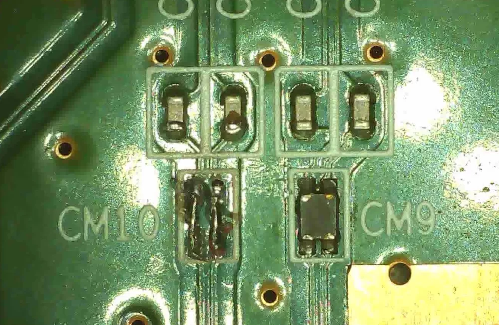Close up of the bridging wires added to the board, to replace CM10
